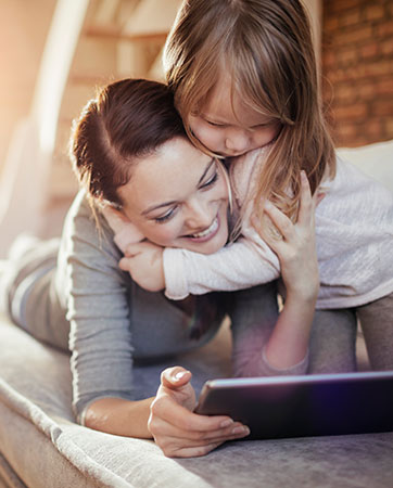 Mother and daughter looking at tablet